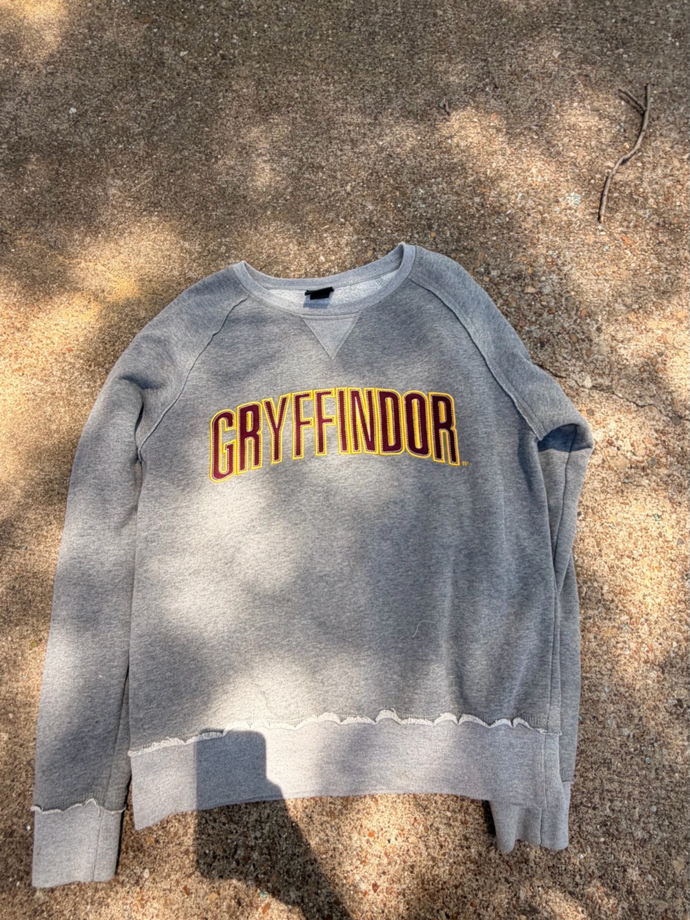Warner Bros. Grey Crewneck with Maroon and Gold Gryffindor Lettering